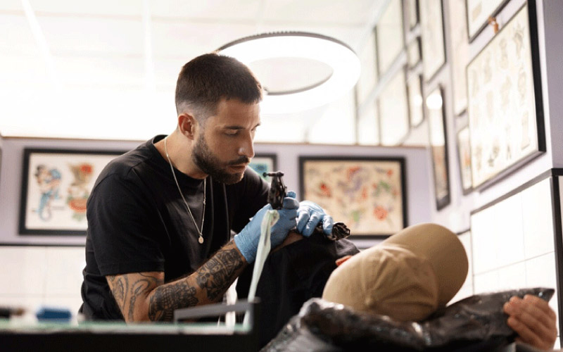 someone getting a tattoo, manchester october 2024