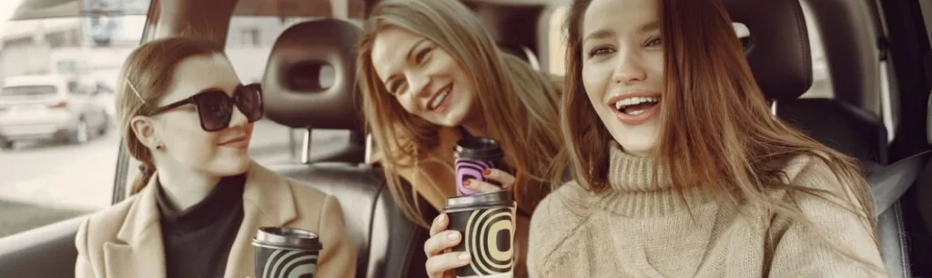 A group of happy holidaymakers boarding a luxury charter bus for a coastal UK getaway, Holiday Coach Services