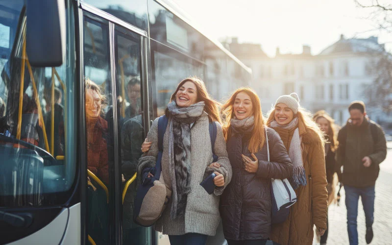 Smiling group boarding a travel bus for a holiday shuttle in Manchester.